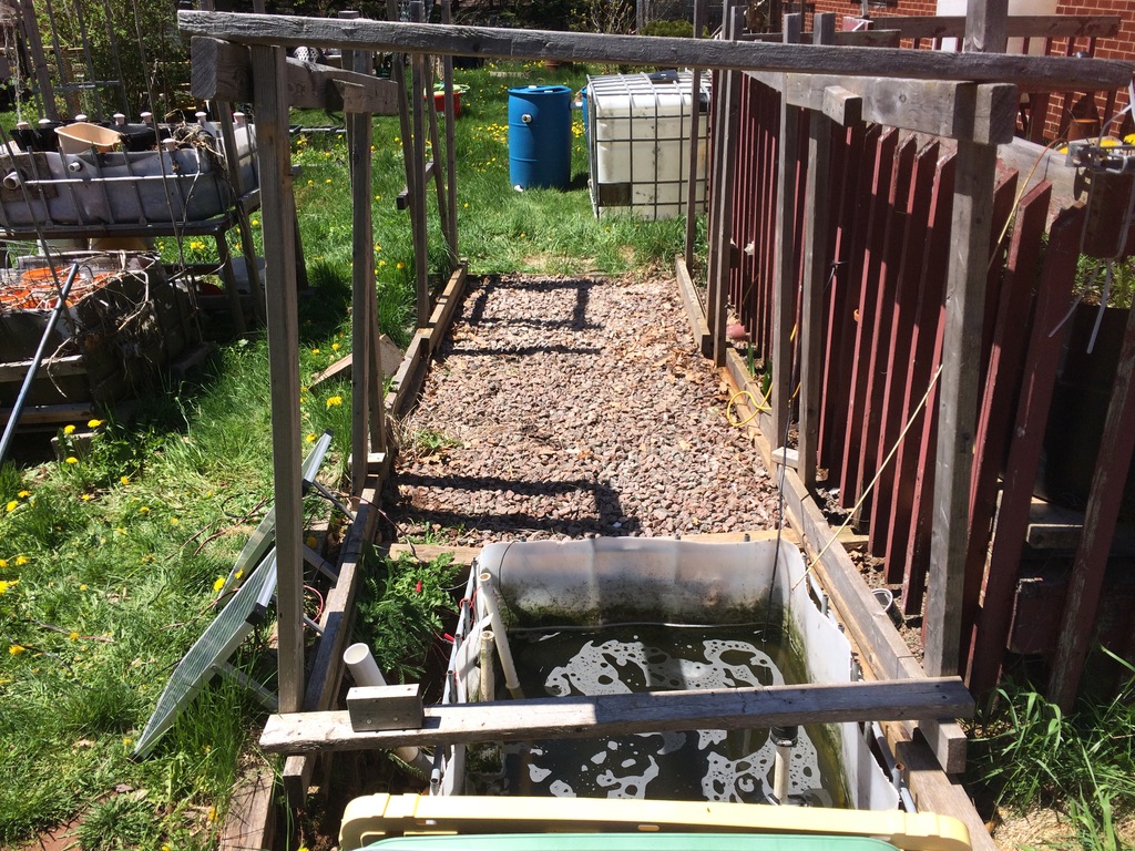 Late May, 2021.  Backyard aquaponics system Mk.III dismantled.  All that remains is the wooden frame and the sump tank.